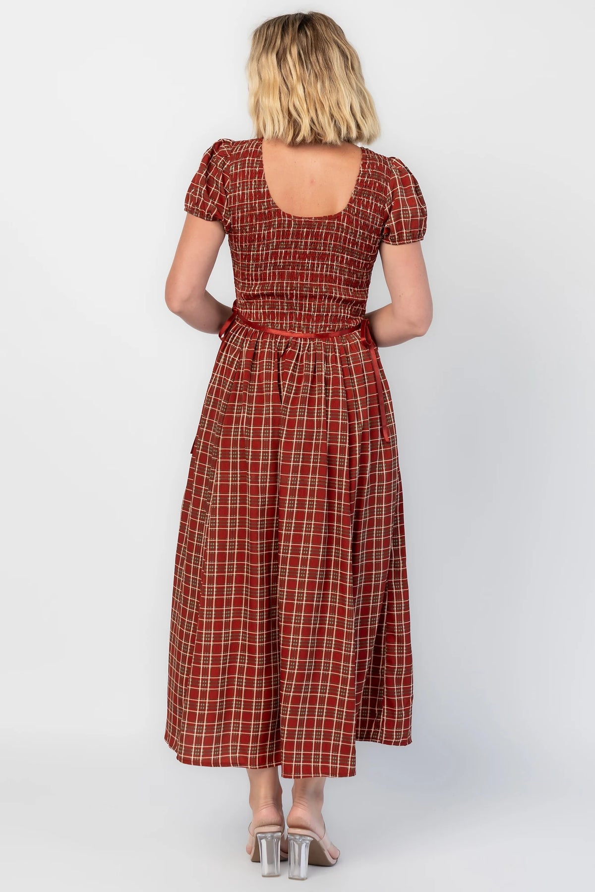Lorelei Smocked Dress in Red Print with round neckline, smocked bodice, and elastic sleeves.