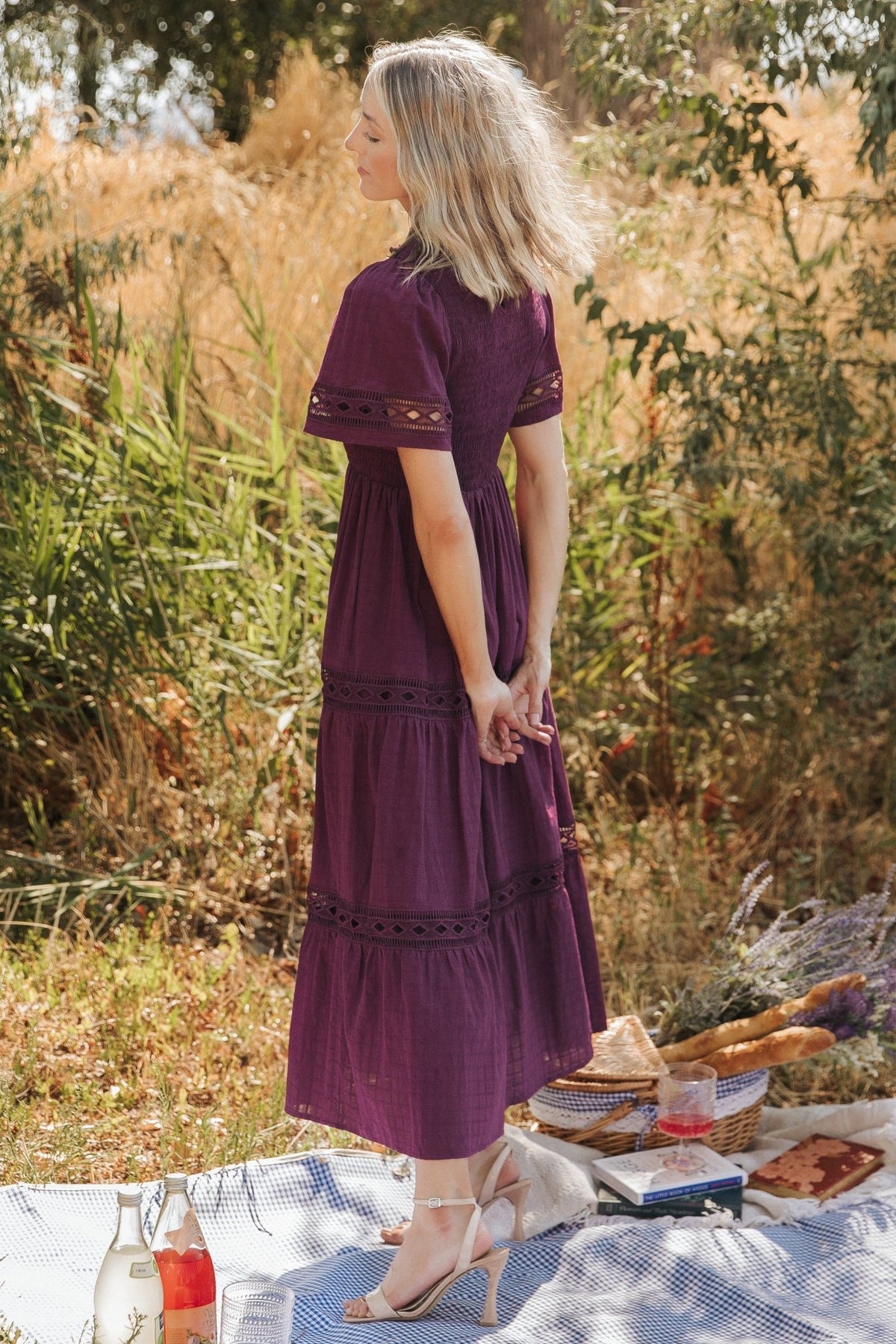 Full-length shot of tiered maxi skirt in motion, demonstrating the lined skirt, flow, and gentle tiered volume of the garment.