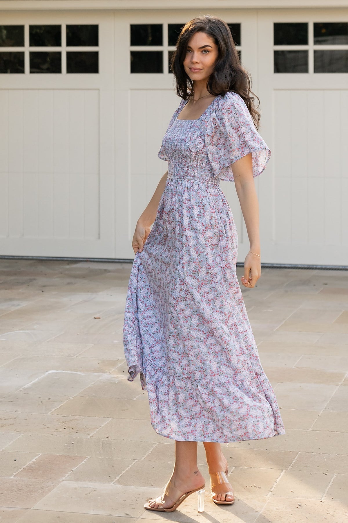 Close-up of smocked bodice and square neckline on dusty blue floral Lyssa dress, showing textured smocking and fitted stretch at the bust.