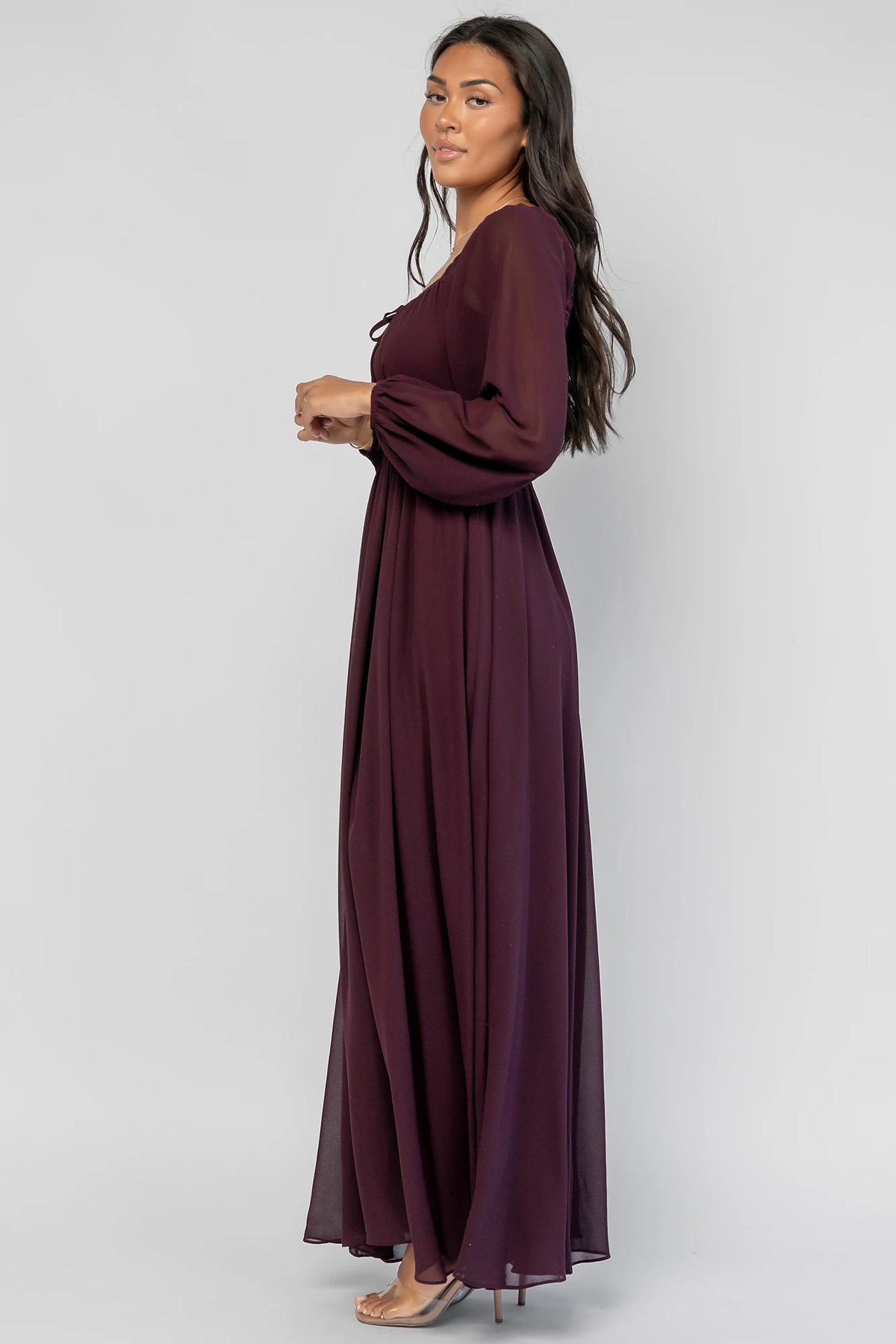 Maddalena Maxi Dress in Dark Plum with embroidered chevron detailing, a sweetheart neckline, and sheer sleeves.