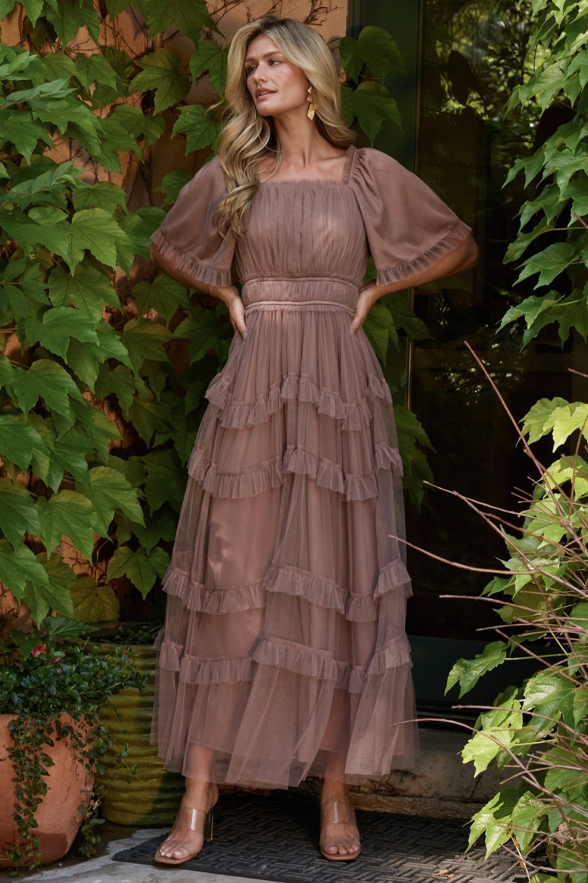 Back and side view of dusty mink Magdalena Tulle Maxi Dress illustrating tiered ruffle skirt and soft drape of the tulle overlay.