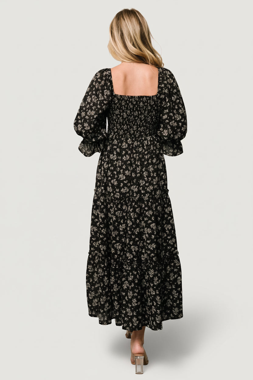 Full-length view of Margareta Tiered Midi Dress in black floral, showing three-tier midi skirt and natural drape of layered chiffon.
