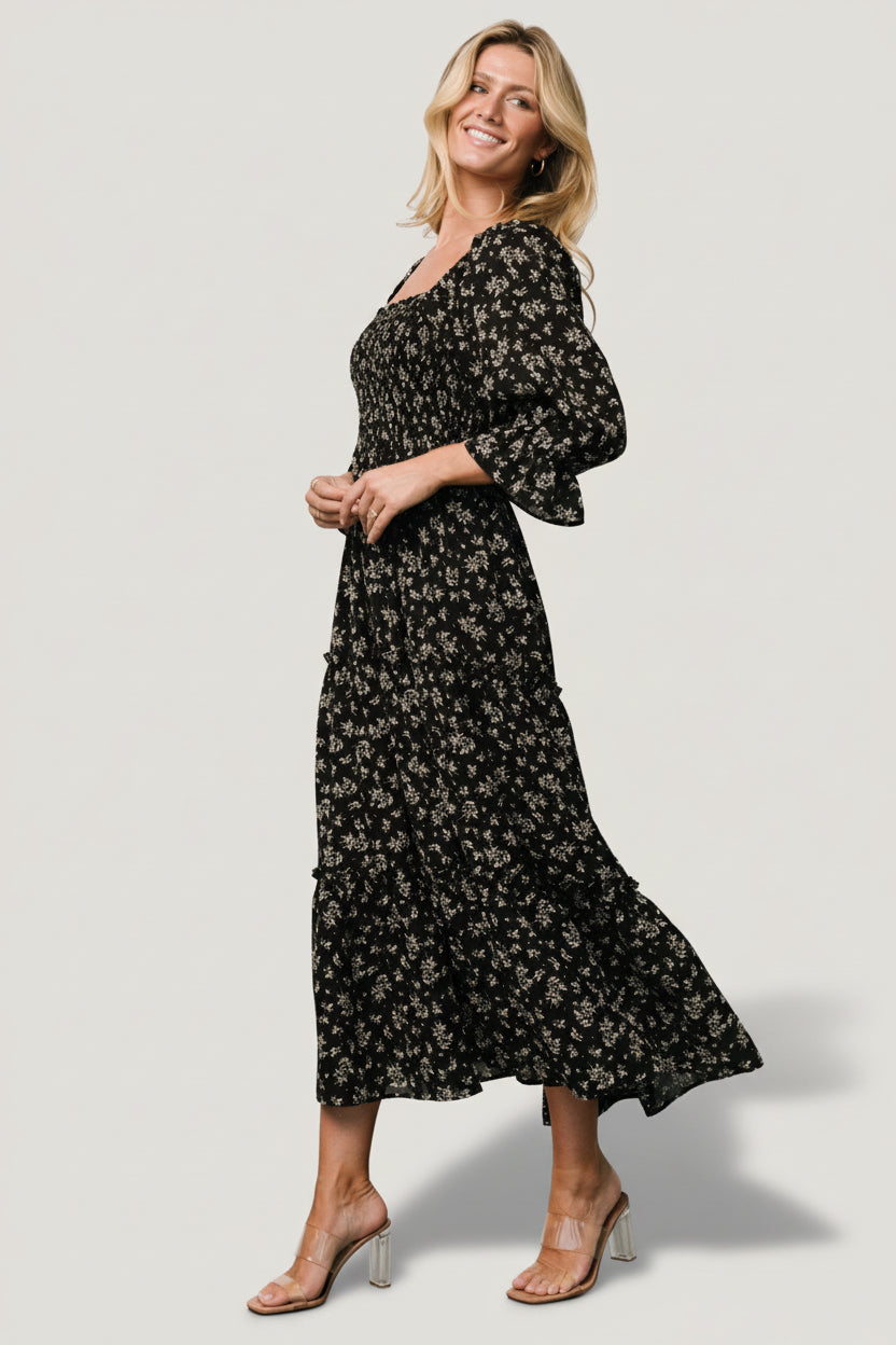 Close-up of Margareta Dress showing smocked bodice and delicate neutral floral print on soft medium-weight chiffon fabric.