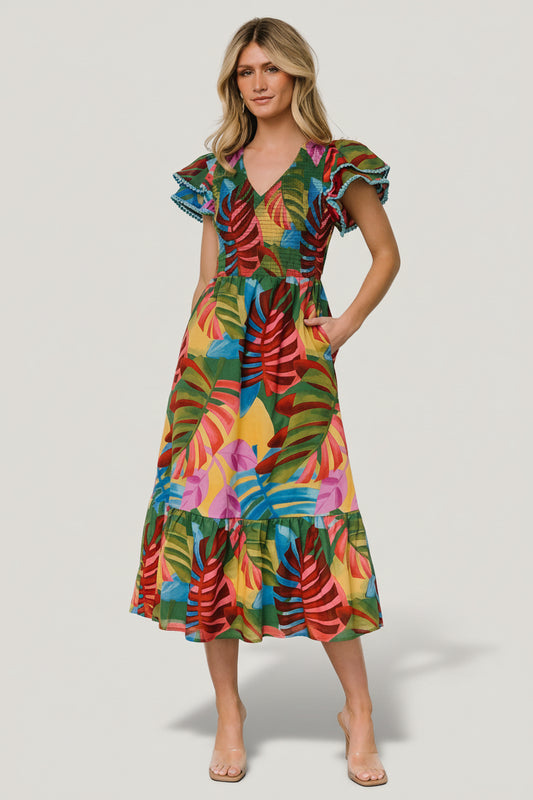 Front view of Marielle smocked midi dress in multicolor tropical leaf print showing smocked bodice and midi hem.