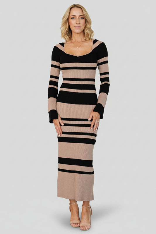 Front view of Marika ribbed midi dress in camel and black stripes, fitted silhouette with deep V-neck and long fitted sleeves, full length.