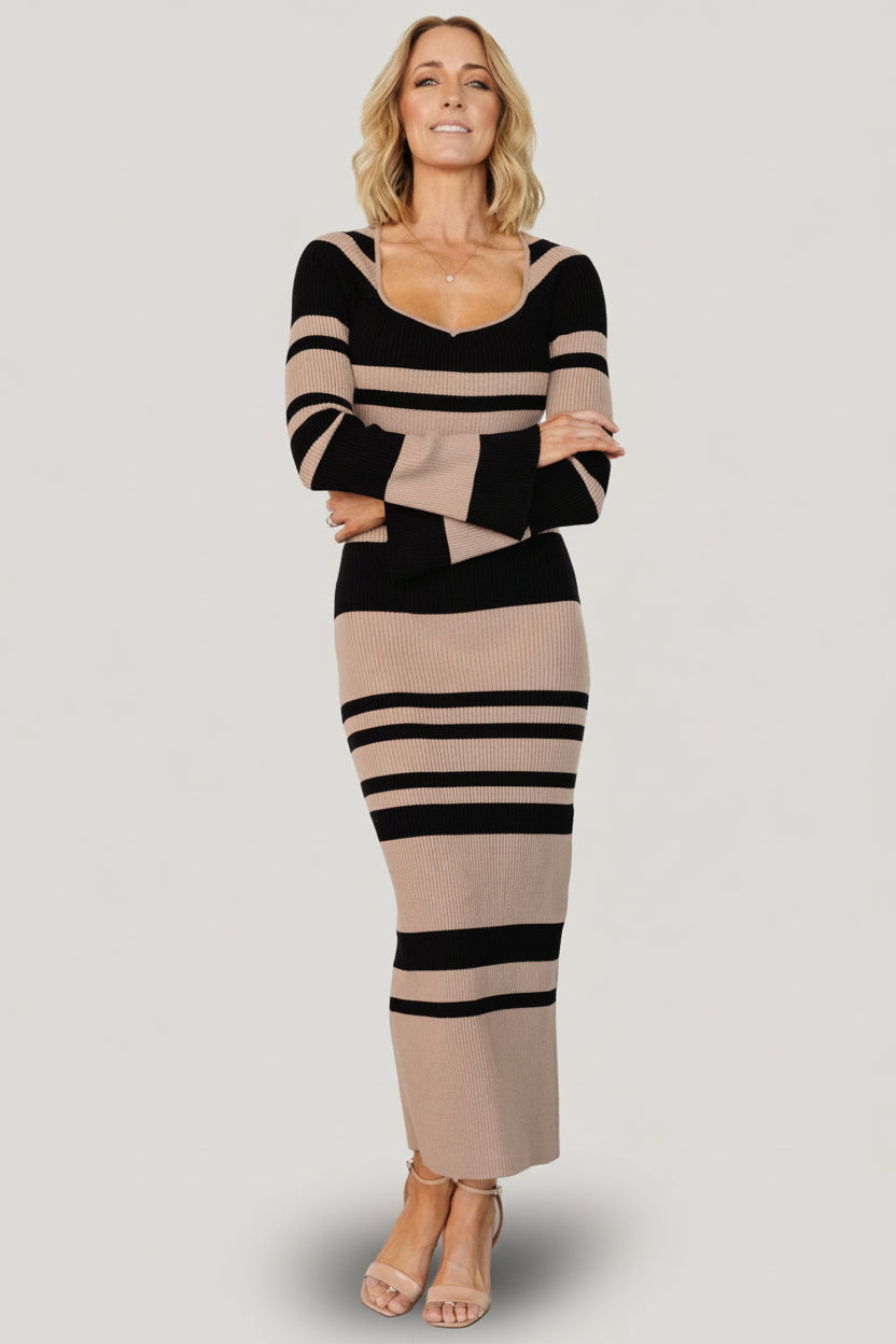 Side view of Marika dress on model demonstrating close-to-body fit, stripe variation and comfortable stretch across the hip and thigh.