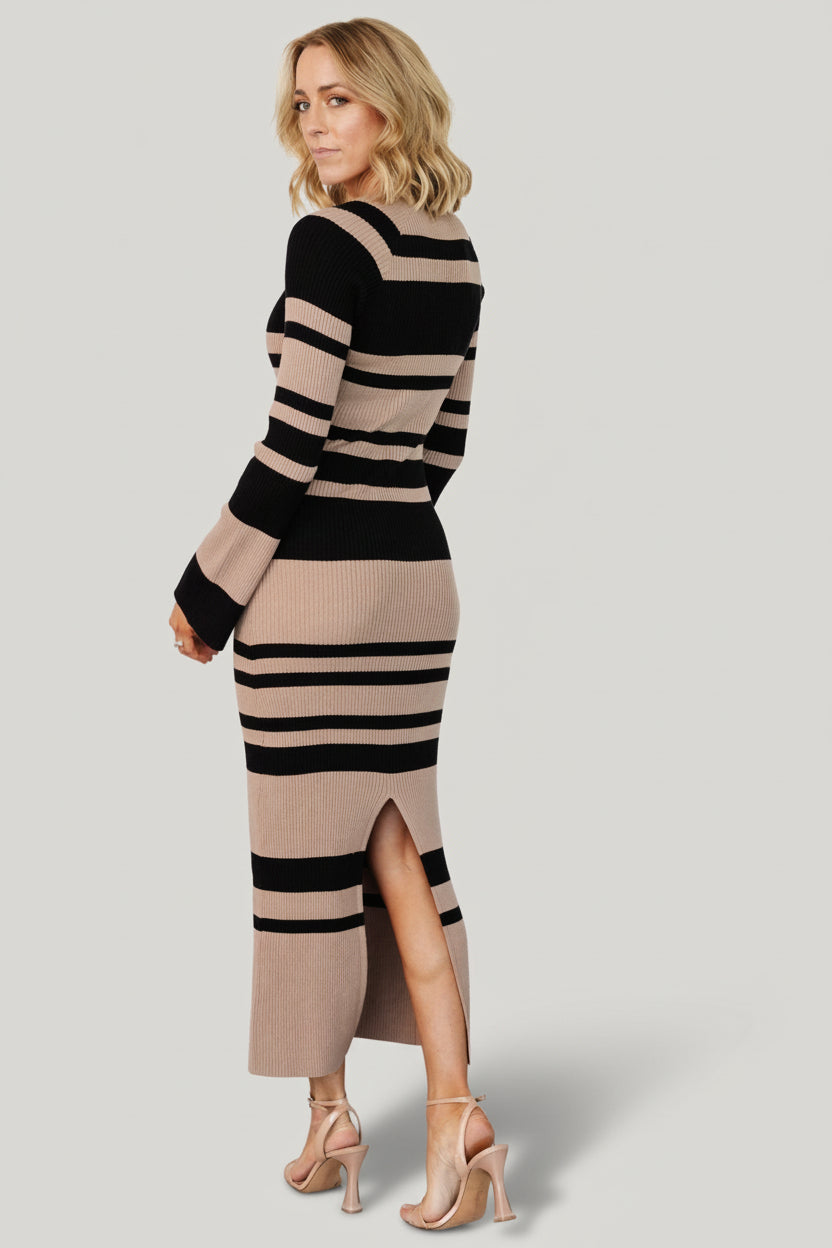 Back view of the Marika ribbed midi dress showing center-back knee-high slit, striped pattern continuity and flattering heel-length fall.