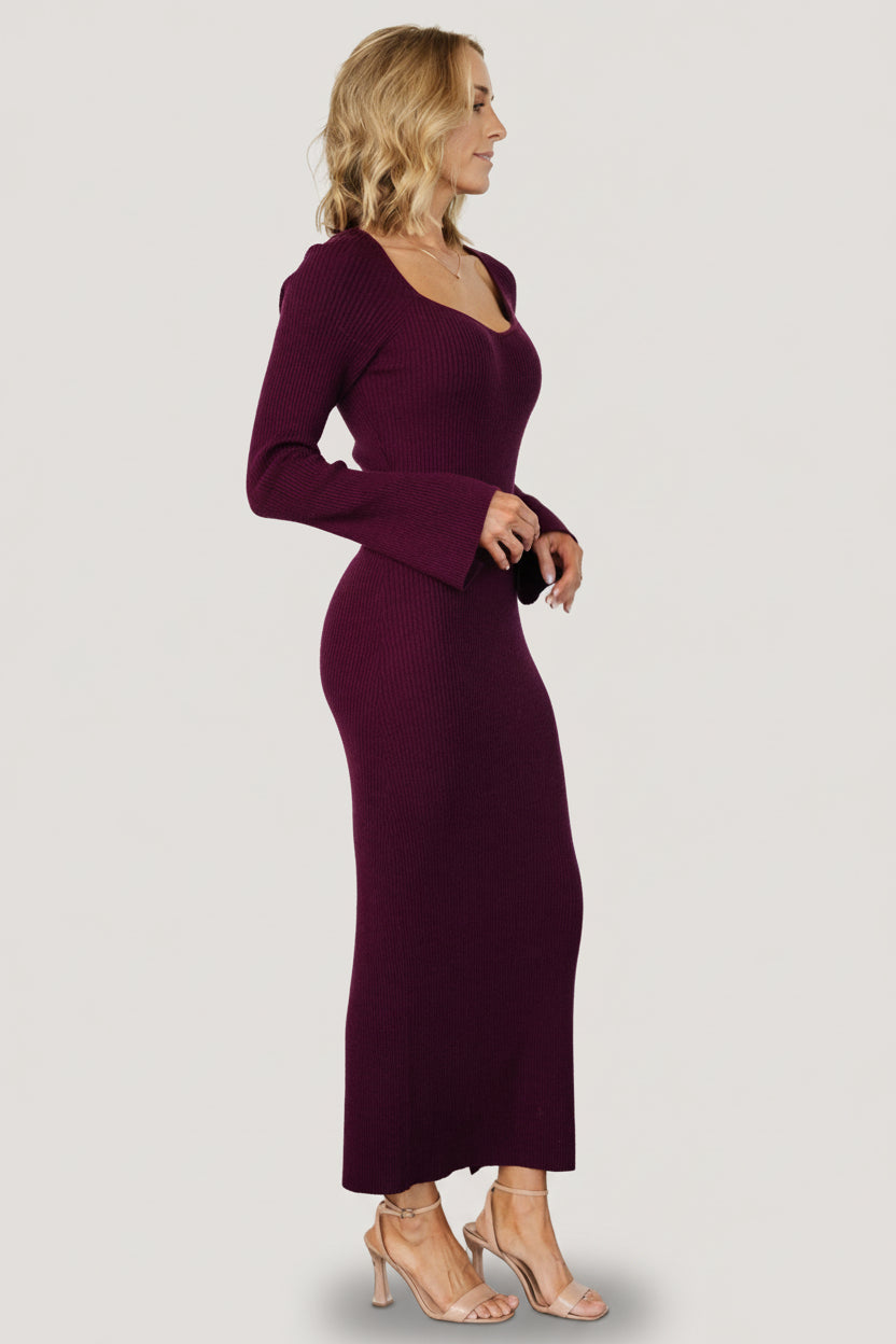 Close-up of Marika Ribbed Midi Dress in merlot showing ribbed knit texture, V-neckline, and fitted long sleeves for a sleek silhouette.