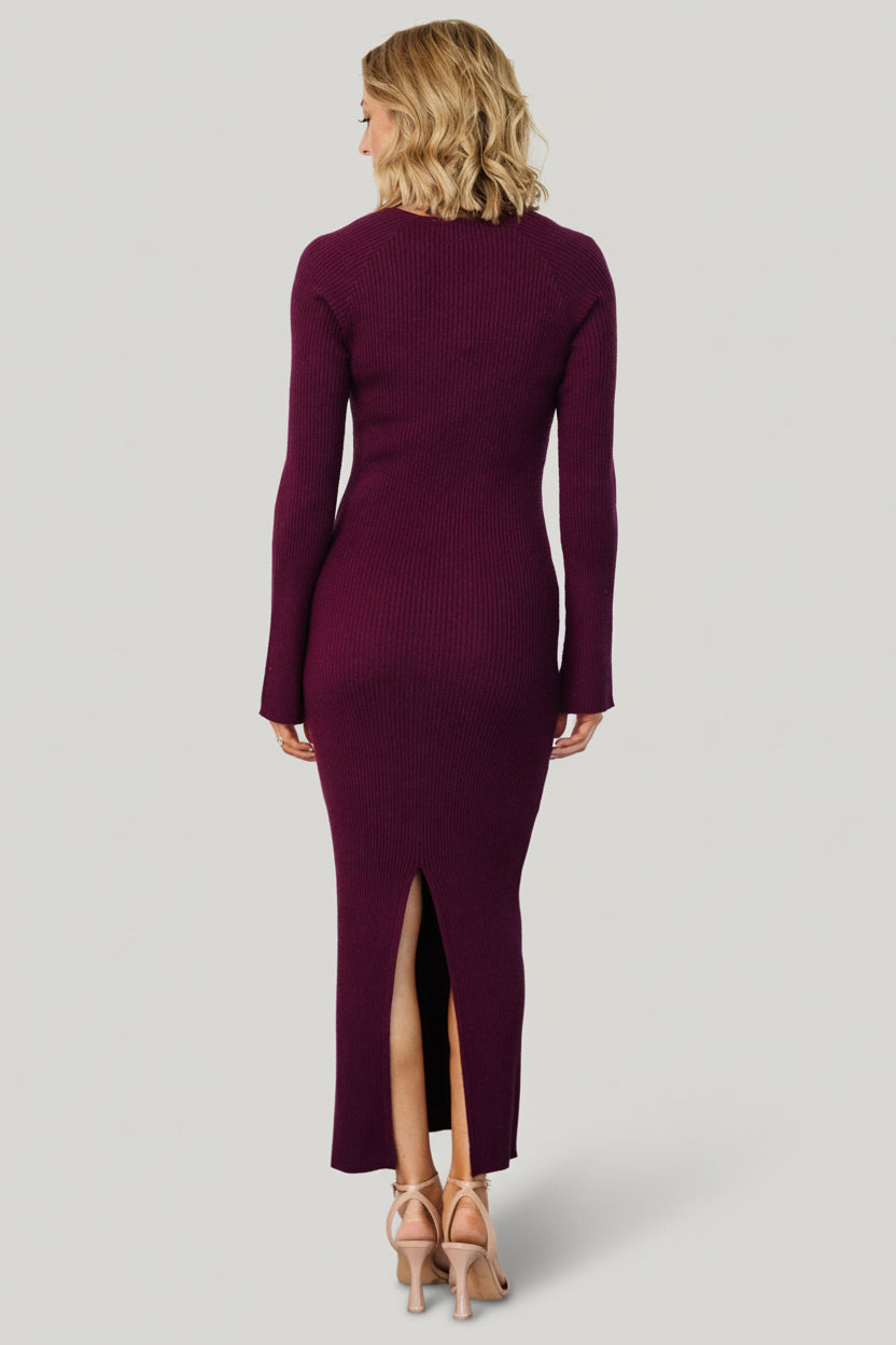 Back view of Marika Ribbed Midi Dress in merlot highlighting the center-back knee-high slit and tailored, close silhouette.