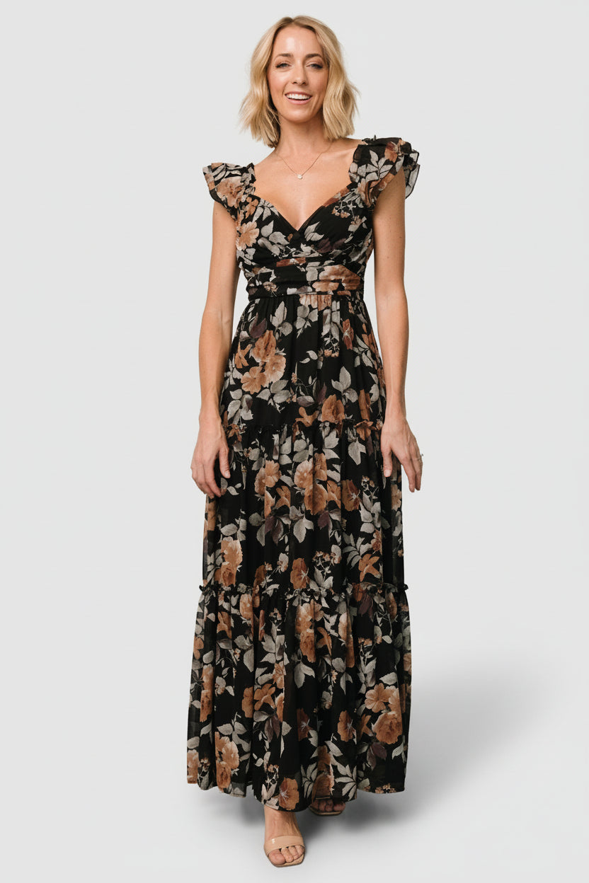 Back view of Martina Maxi Dress in black with copper florals, showing smocked back bodice and gentle skirt fullness at the hem.