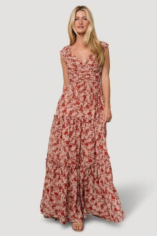 Model front view wearing Martina Maxi Dress in blush with red floral chiffon, wide V-neck and flutter sleeves, full maxi length.