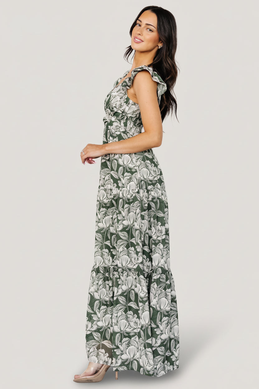 Back view of Martina Maxi Dress in green and white floral chiffon showing smocked back bodice, elastic shoulder and flowing maxi skirt.
