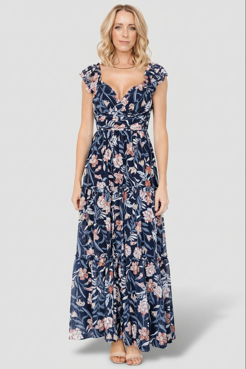 Detail view of double-layered flutter sleeve and elastic shoulder with delicate ruffle on the navy multi Martina Maxi Dress.