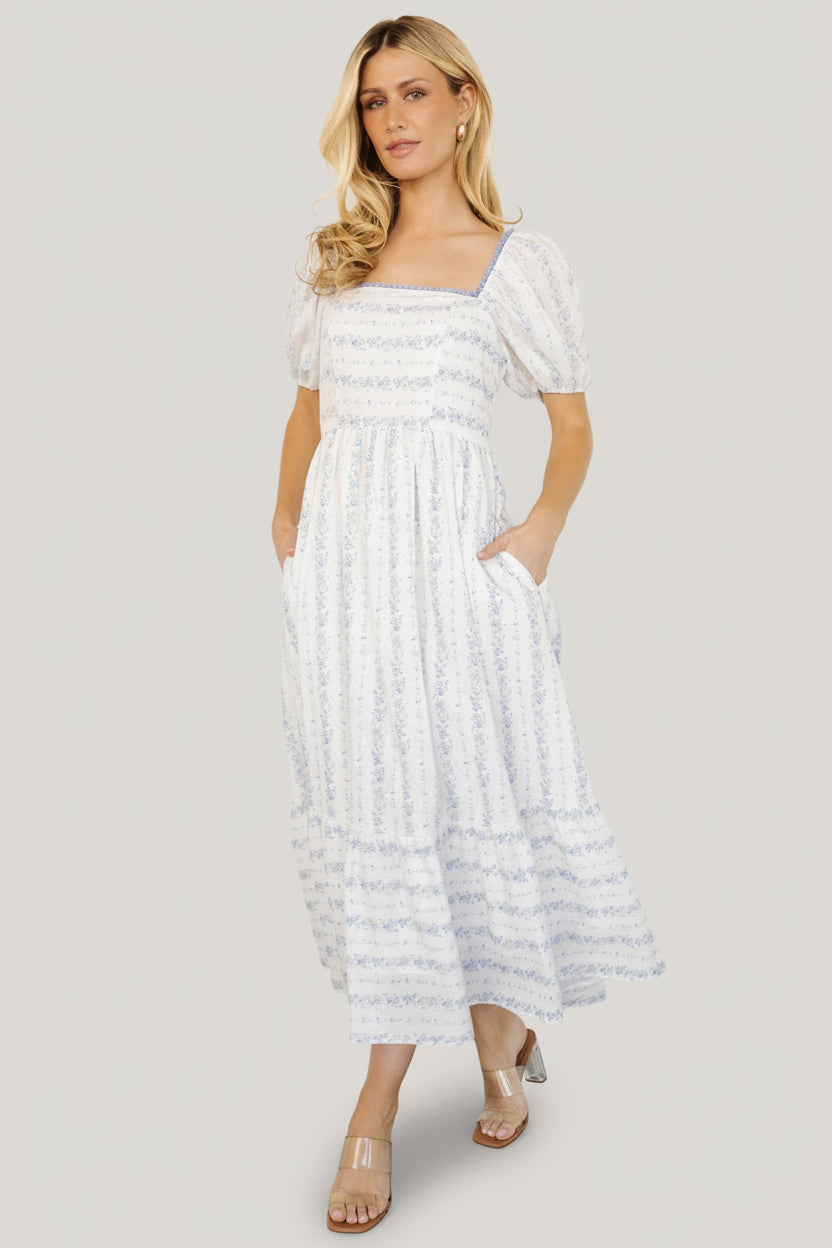 Front view of Martine Puff Sleeve Midi Dress in ivory multi floral showing square neckline, scalloped trim, puff sleeves, and single-tiered midi skirt.