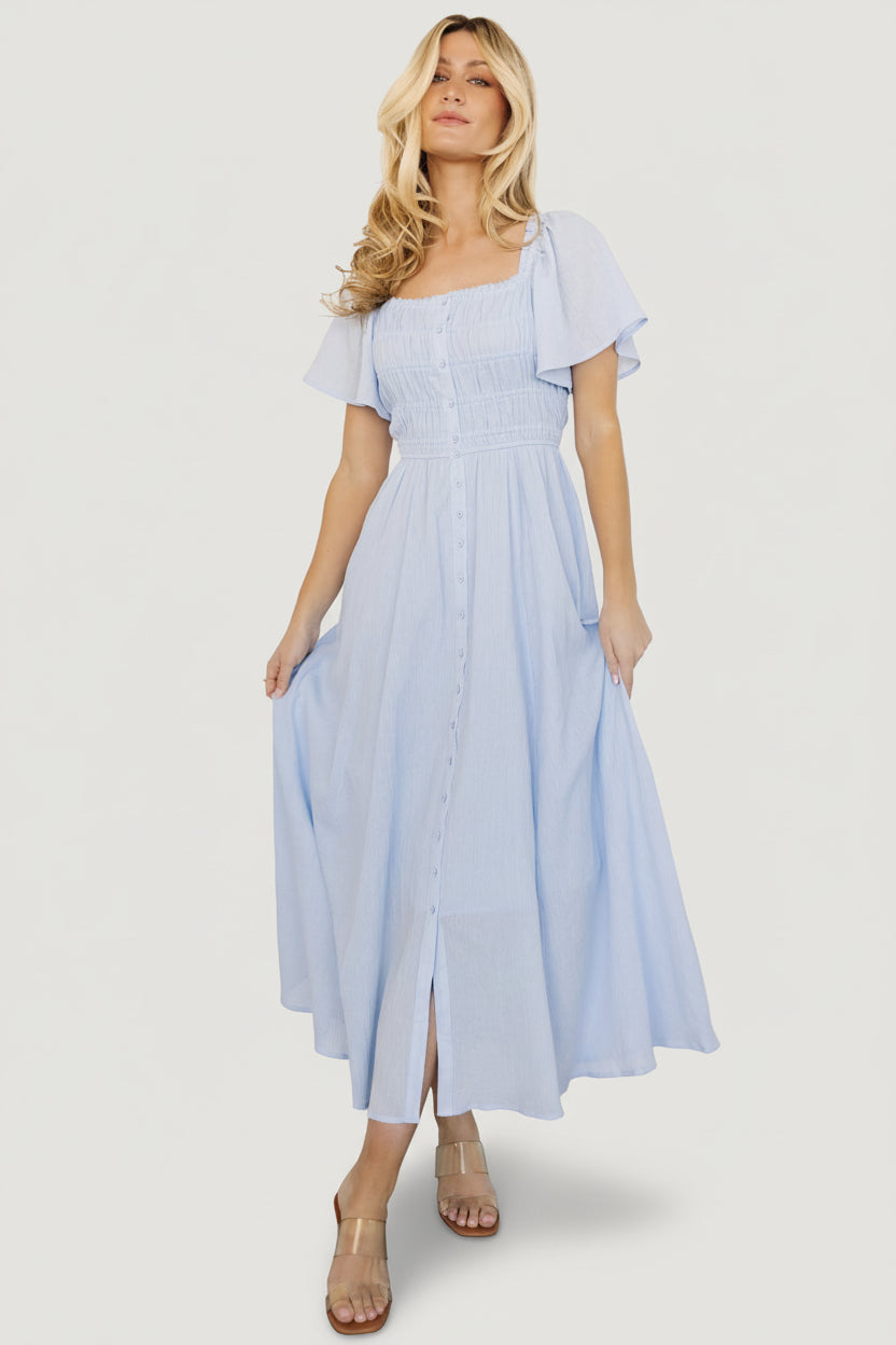 Back view of McKay maxi dress displaying elastic back detail of the bodice and gentle skirt drape.