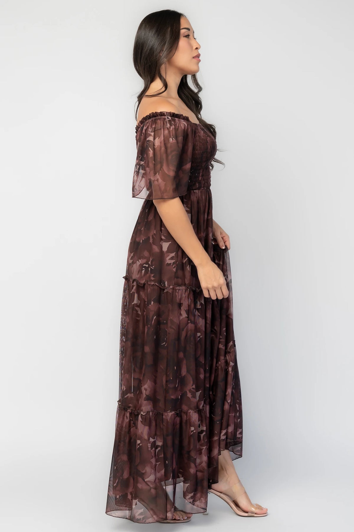 Meya Mesh Maxi Dress in Dark Mahogany Print with abstract florals, smocked bodice, flutter sleeves, and tiered skirt.