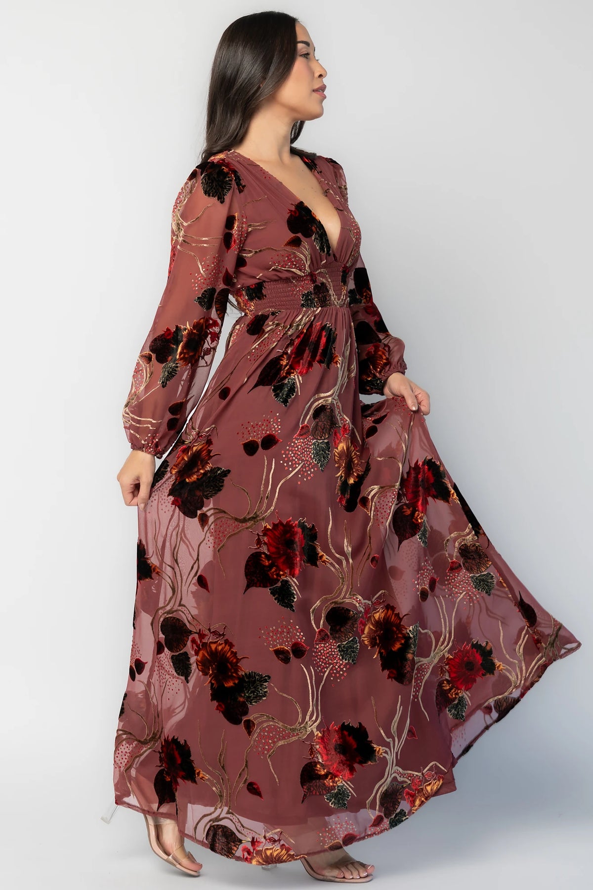 Mikla Maxi Dress in Berry Multi with burnout velvet print, deep V-neckline, long sleeves, smocked waist, and asymmetrical hem.