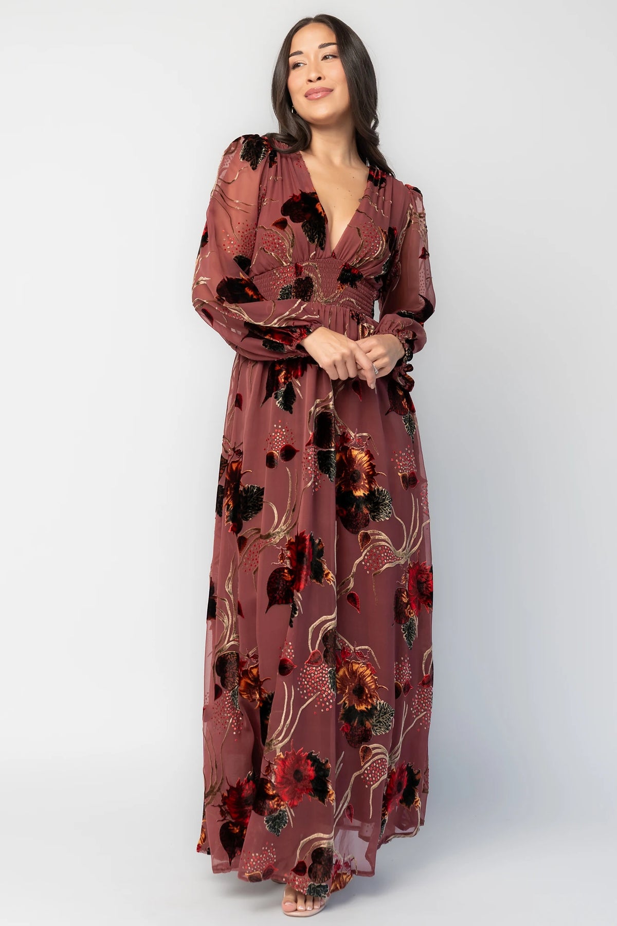 Mikla Maxi Dress in Berry Multi with burnout velvet print, deep V-neckline, long sleeves, smocked waist, and asymmetrical hem.