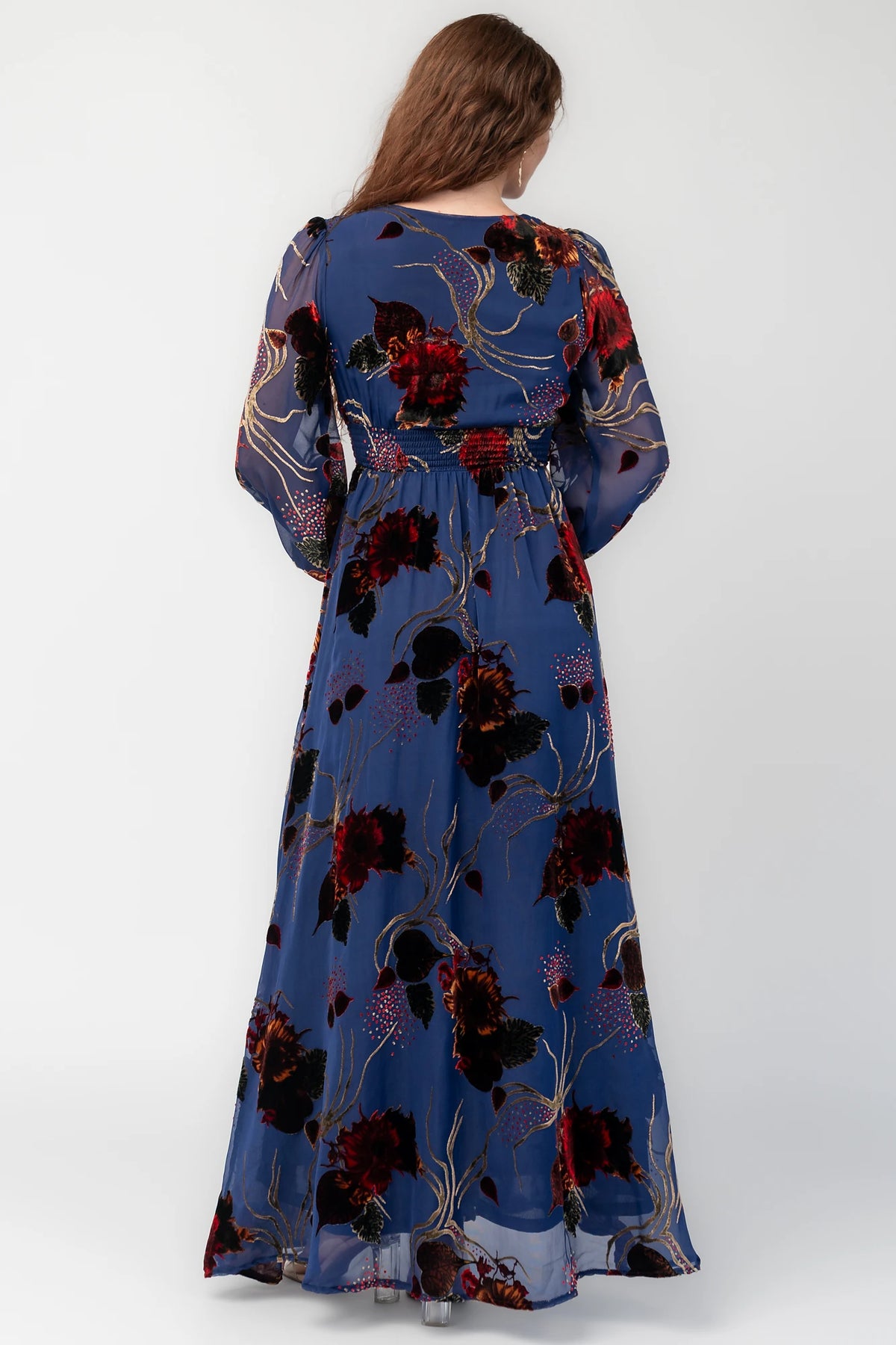 Mikla Maxi Dress in Blue Multi with burnout velvet, deep V-neck, long sleeves, smocked waist, and asymmetrical hem.