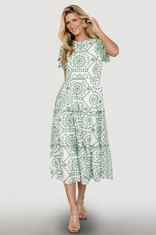Front view of Mirabel embroidered eyelet midi dress in white with Kelly green eyelet, ruffled high neckline and tiered skirt detail.