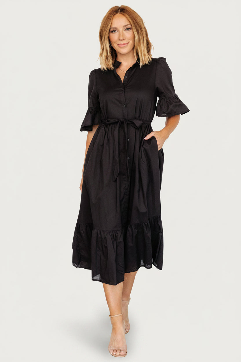 Detail image of the Mirielle dress sleeve showing the ruffled cuff, short flowy sleeve, and unlined construction.