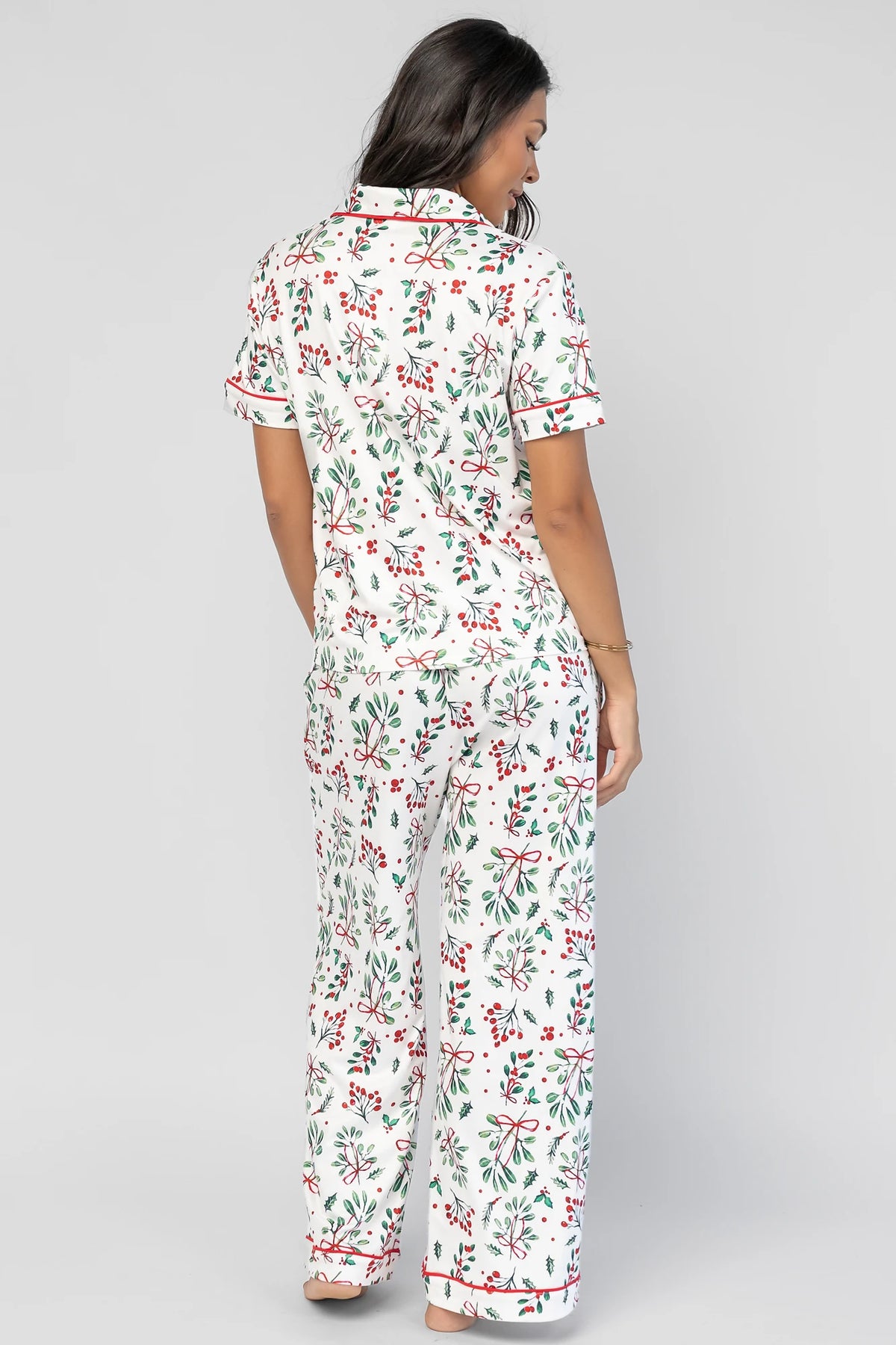 Mistletoe Cozy Pajama Set in Ivory Multi with a festive mistletoe and holly print, button-front top, and contrast piping.