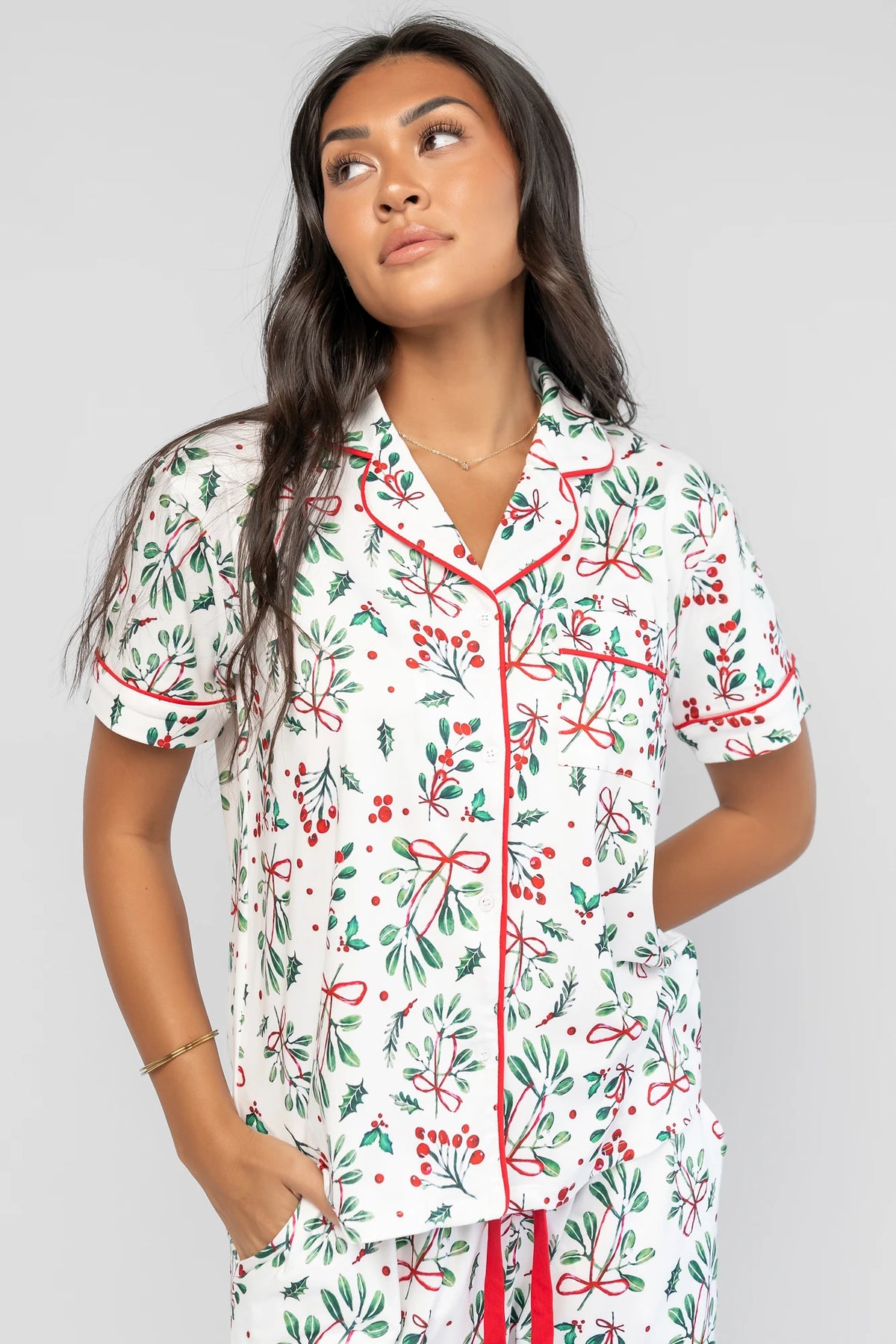 Mistletoe Cozy Pajama Set in Ivory Multi with a festive mistletoe and holly print, button-front top, and contrast piping.