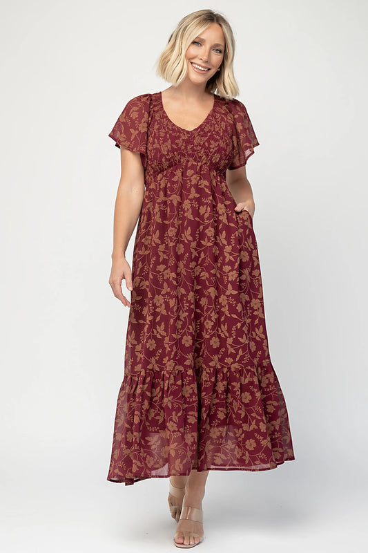 Monica Smocked Dress in Wine + Gold with V-neckline, smocked bodice, flutter sleeves, high waist, and tiered skirt.