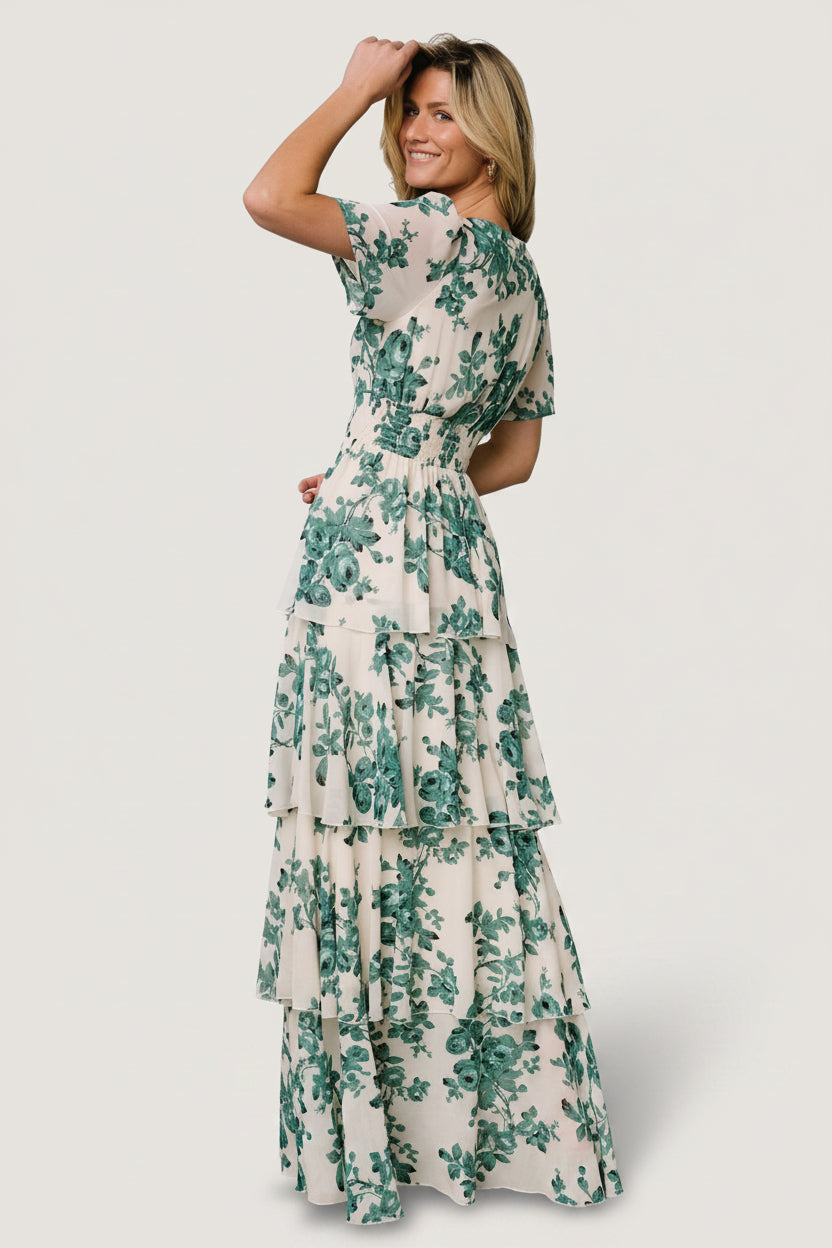 Close-up of green floral print on ivory ground, showing chiffon texture and delicate ruffle edge detail.