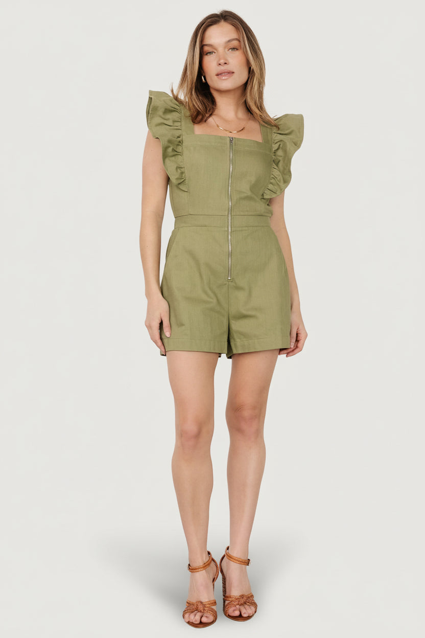 Front view of olive denim-look romper with square neckline, flutter sleeves, front zipper and shorts with pockets on model, full body.
