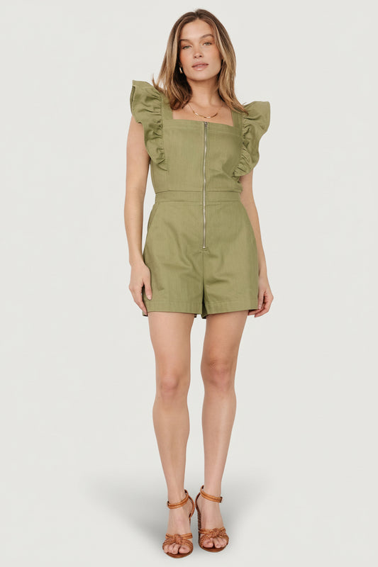 Front view of olive denim-look romper with square neckline, flutter sleeves, front zipper and shorts with pockets on model, full body.