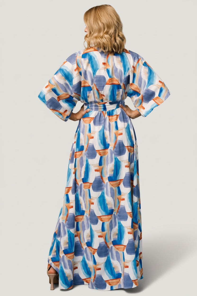 Back view of brushstroke-print maxi showing relaxed fit, gentle drape, and length that falls to a full maxi hem.