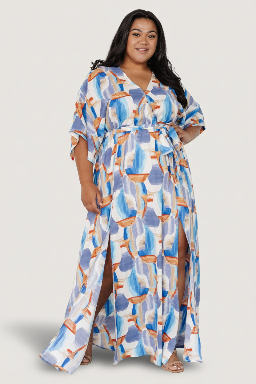 Side view highlighting the flowing maxi skirt and high front slit on both sides for a breezy, elevated silhouette.