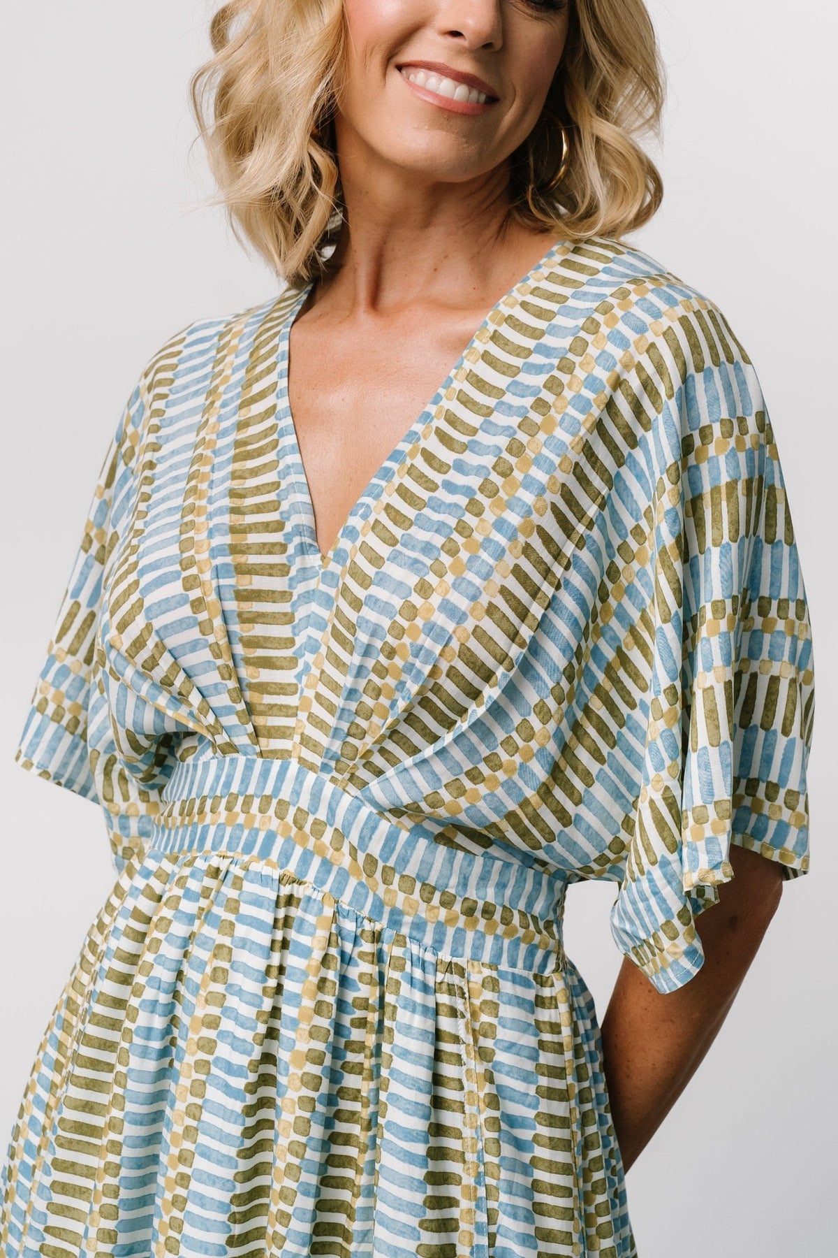 Detail view of the smocked back waist and self-tie on the Mylis Kimono Dress, showing gathered shaping and adjustable fit in rayon.