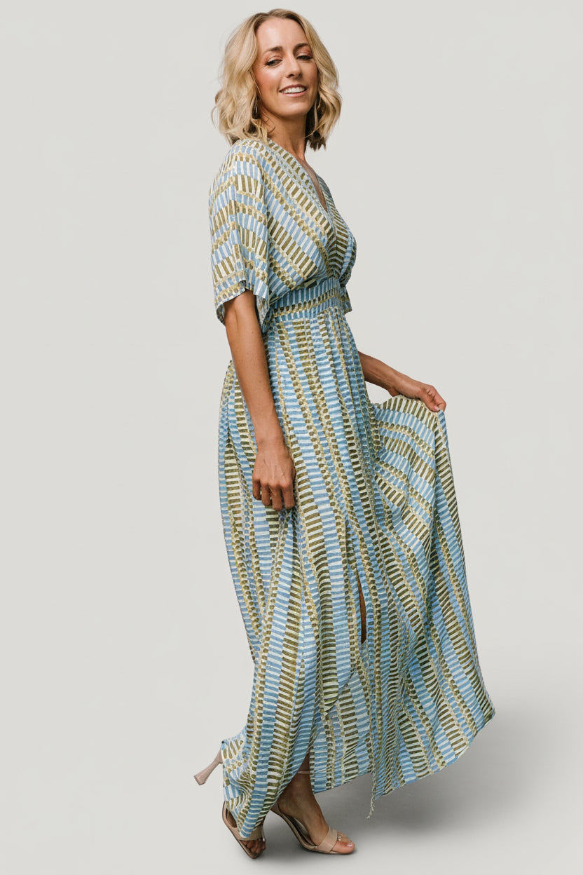 Side view highlighting the right and left leg slits and lined skirt from waist to above knee on the Mylis Kimono Maxi Dress.