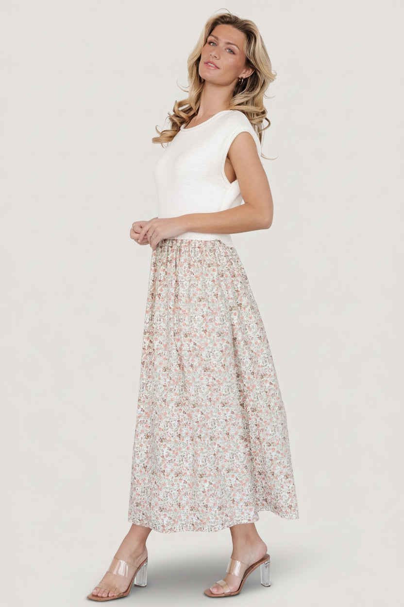 Side view of Myra dress highlighting natural elastic waistline and soft drape of the lined floral skirt.
