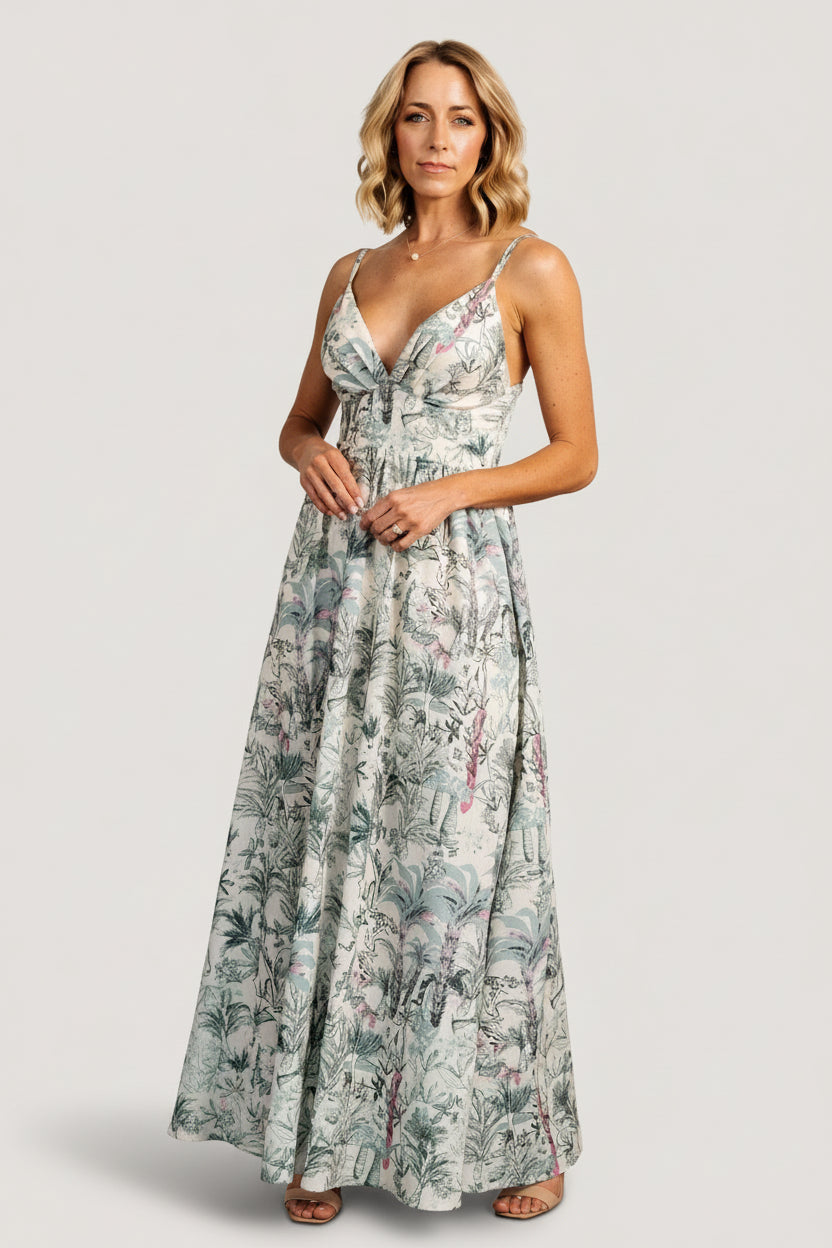 Styled look of Naia Maxi Dress on model walking, illustrating the flowy maxi skirt, gathered bust, and flattering high-waist silhouette.