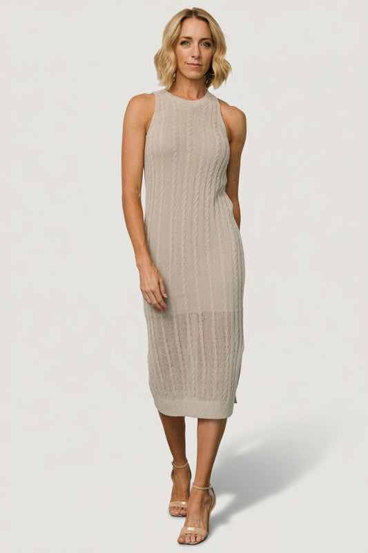 Front view of Nalani Knit Tank Dress in Stone showing the fitted midi sheath silhouette, round neckline, and left-side slit for ease of movement.
