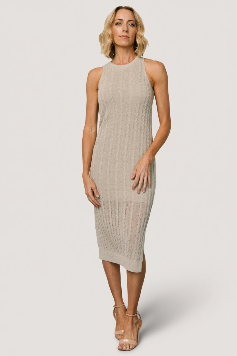 Side view of the Nalani Knit Tank Dress in Stone showing the left-side slit and the smooth, lined interior to the knee.