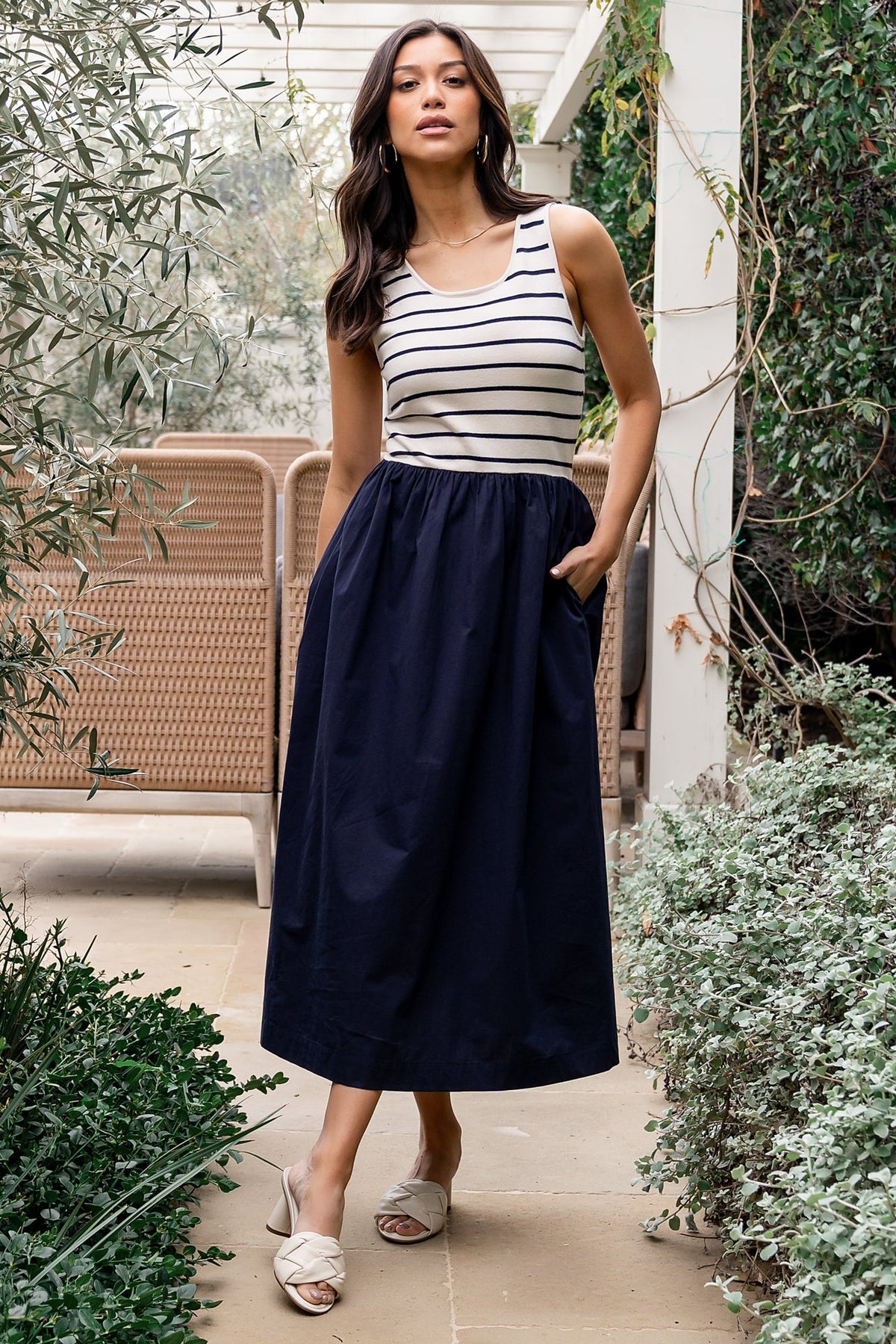 Close-up of sweater-knit bodice with navy and neutral stripes, highlighting knit texture and scoop neckline detail on the tank dress.