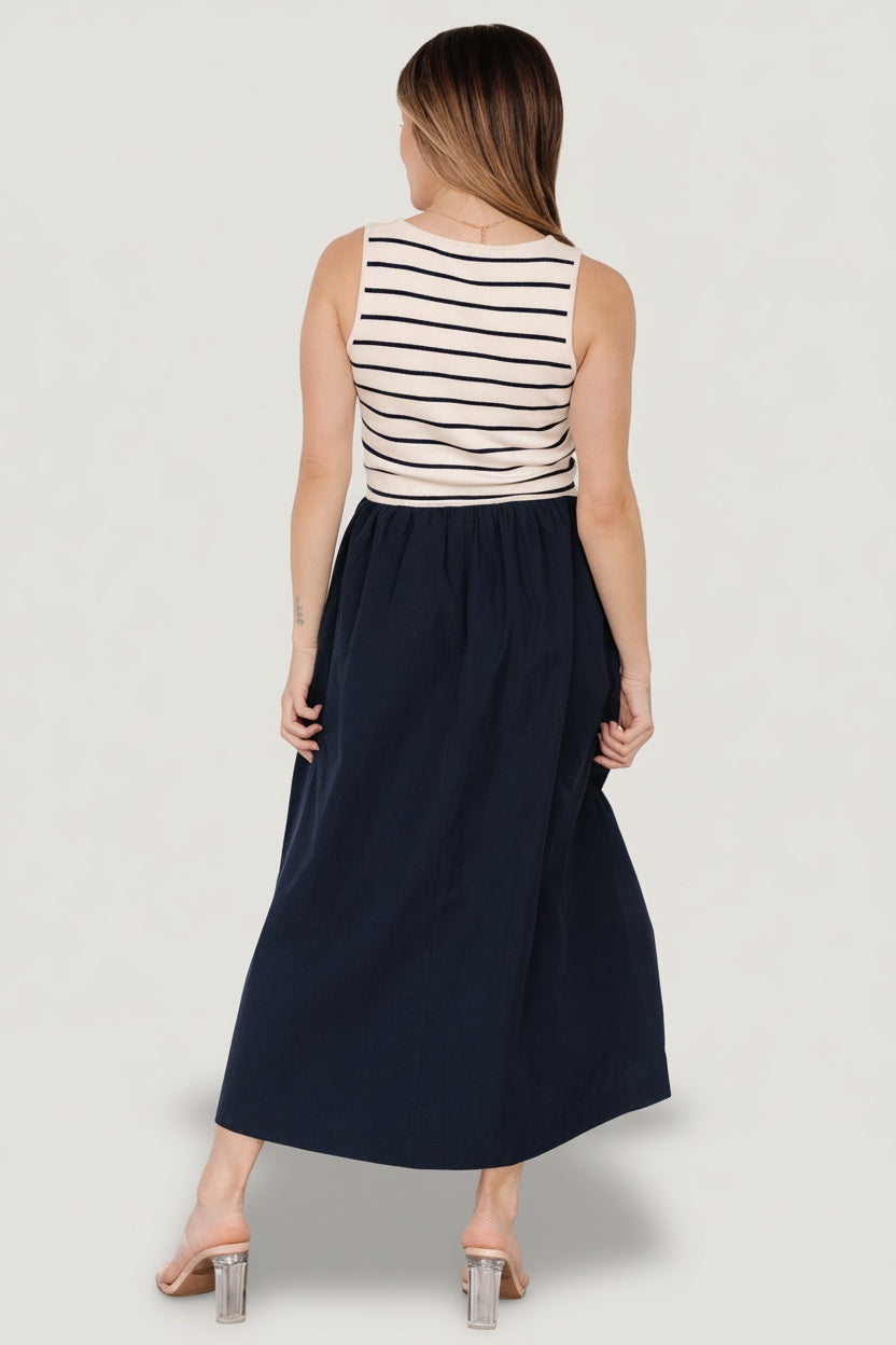 Detail view of the cotton-blend skirt fabric and hem, highlighting unlined construction and lightweight drape for warm-weather wear.