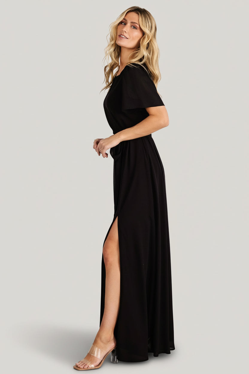 Fabric close-up of lightweight black chiffon and lining layers, highlighting semi-sheer sleeves and smooth lined bodice.