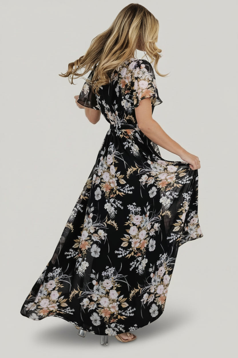 Studio full-length shot of the dress on a model displaying overall fit, length, and how the skirt falls with movement.