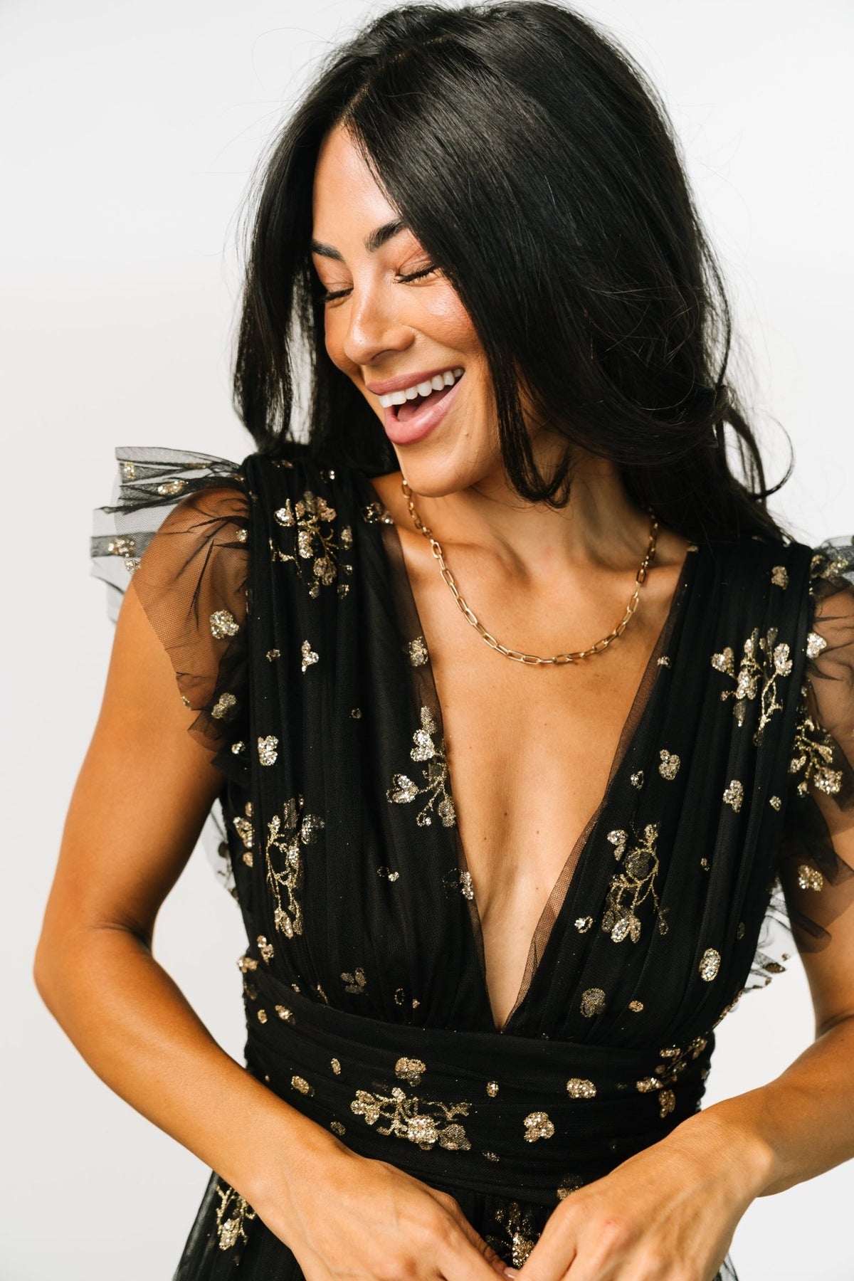 Rear view of Natalia dress displaying deep V-back, hidden zipper with hook-and-eye closure, and the high banded waist shaping the silhouette.