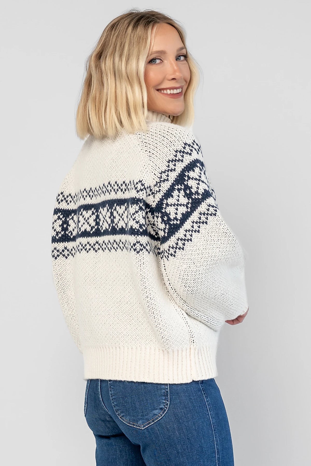 Neve Sweater Jacket in Cream + Navy with a Fair Isle knit pattern, turtleneck, silver zip-front design, and cozy thick knit.