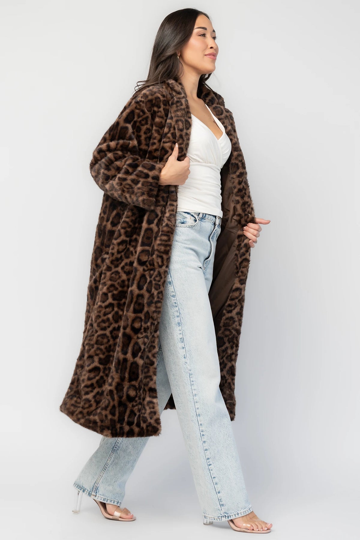 Novalie Coat in Brown Leopard Print with plush faux fur texture, notched collar, long sleeves, and longline silhouette.