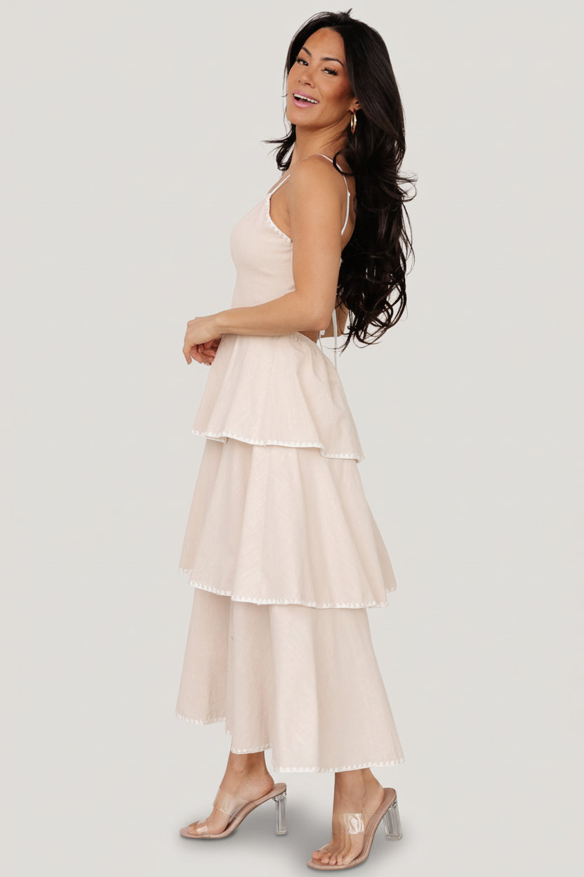 Model wearing the Odette Tiered Dress in natural; shows fit and length on a 5'3" model wearing size S.