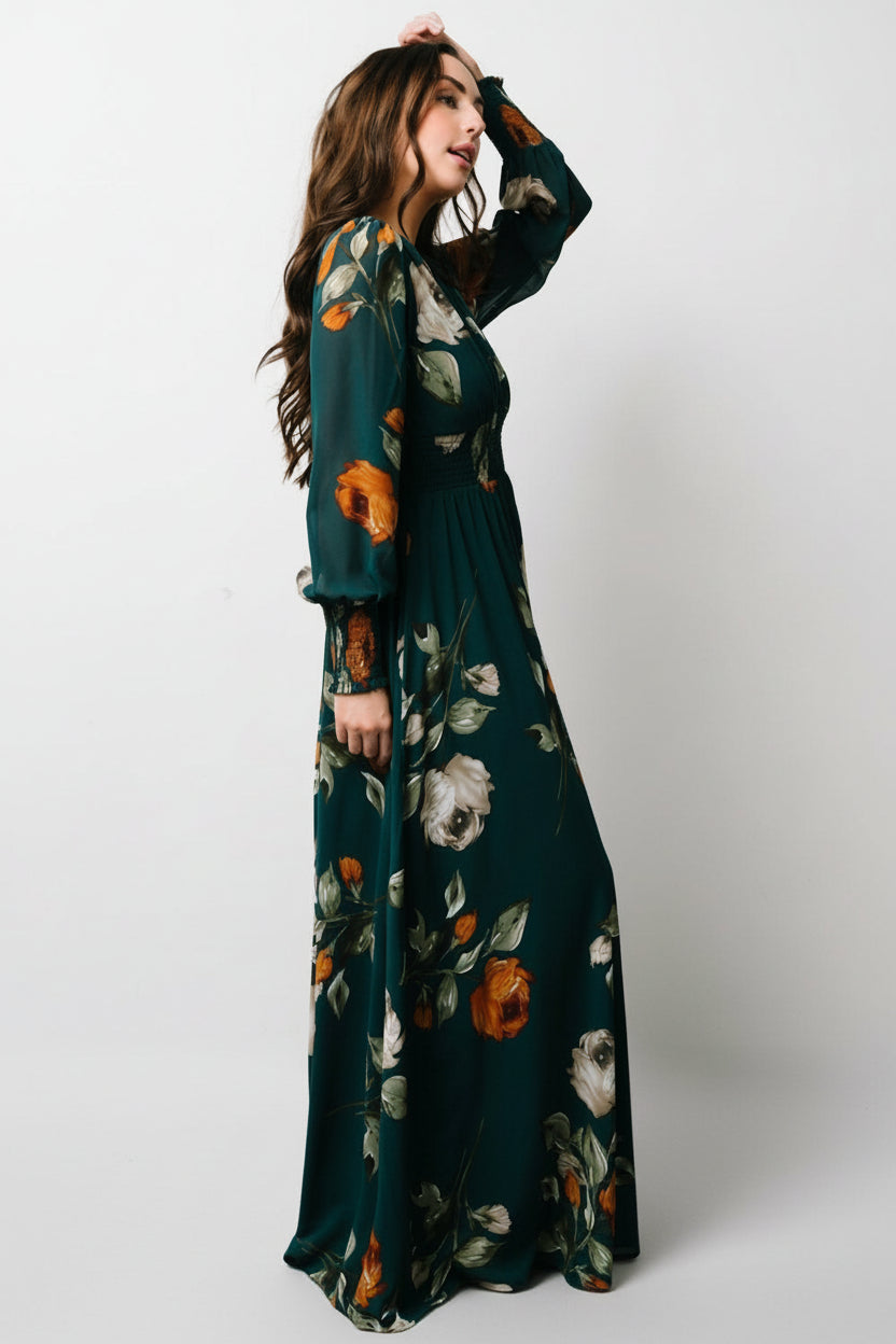 Model demonstrating bump-friendly fit in the Olivia Maxi Dress, highlighting smocked waist and lined skirt for comfort.