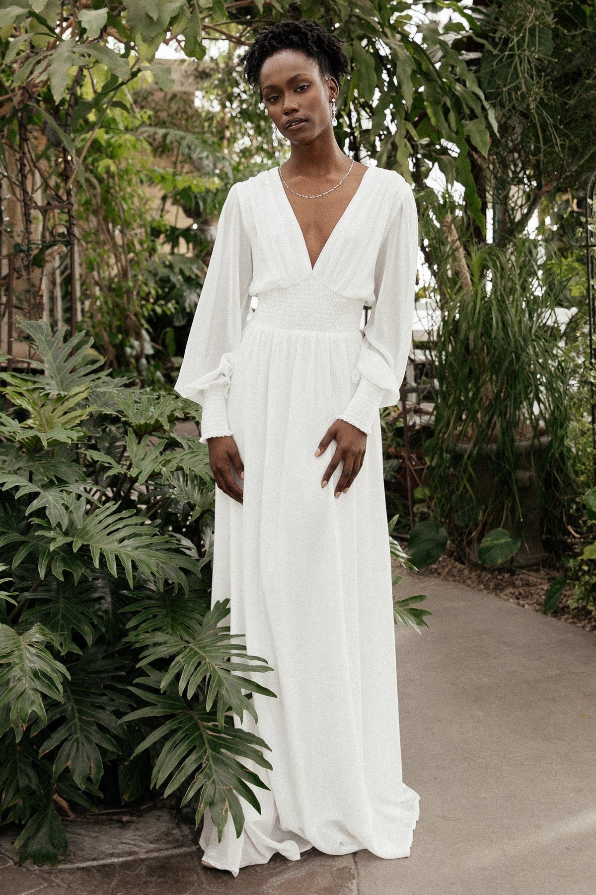 Detail view of Olivia Maxi Dress white fabric and lining showing the soft chiffon overlay and thicker inner lining used to reduce transparency.