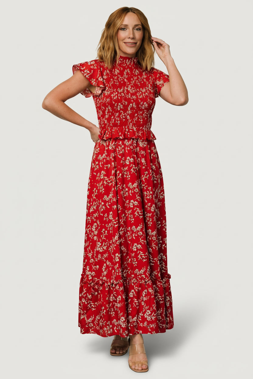 Full-length look of red floral maxi dress highlighting single bottom tier with ruffle and soft flowing silhouette.